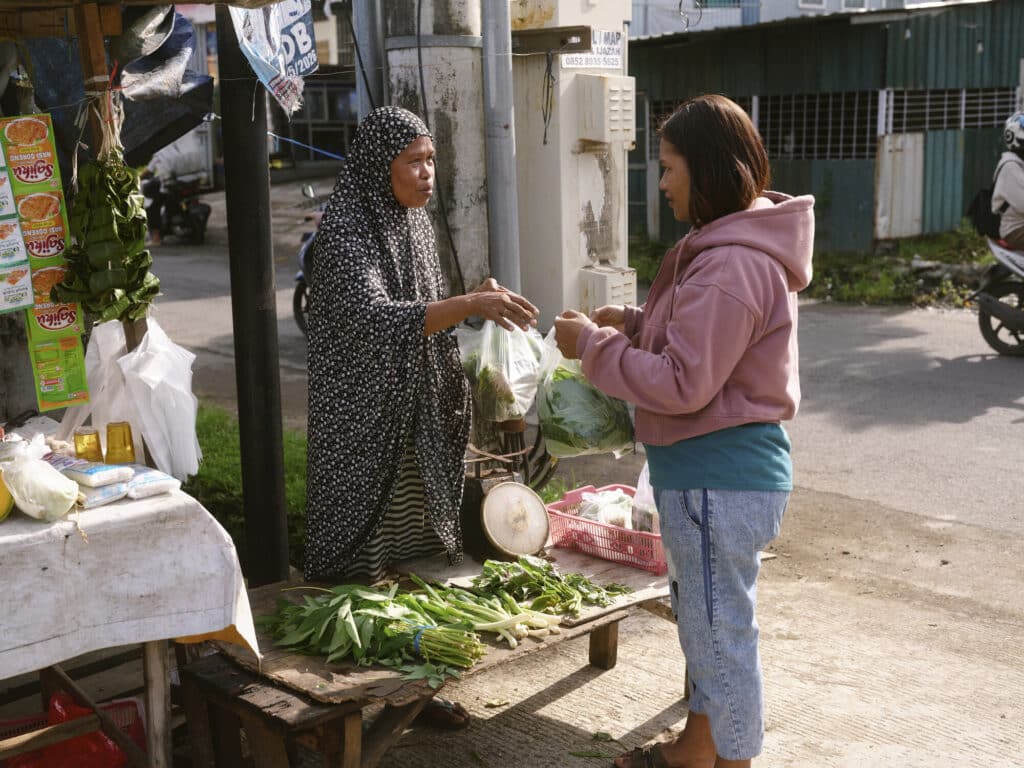 Adifa selling her vegetables